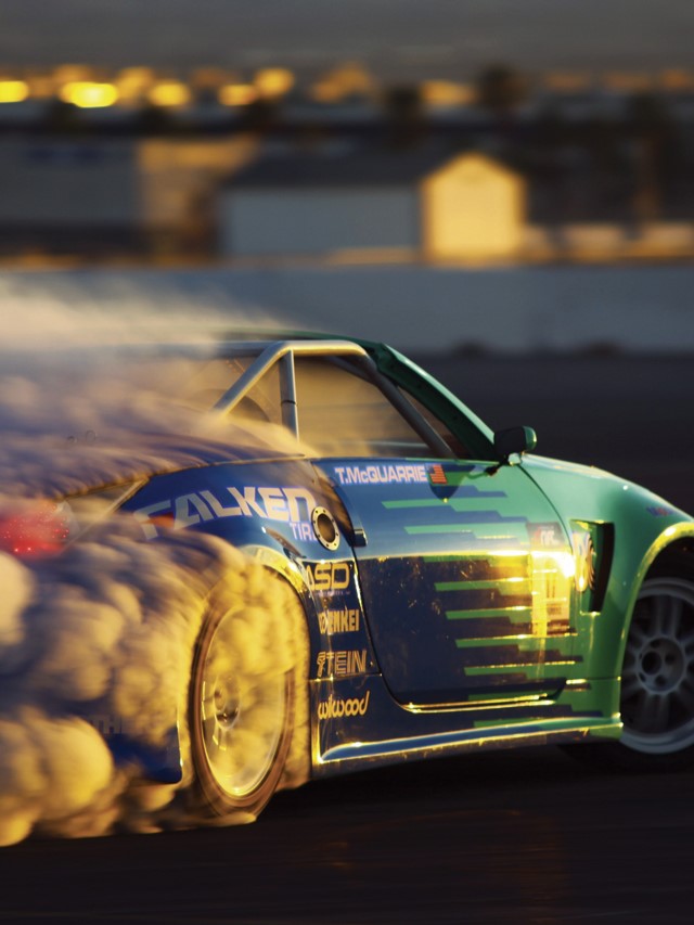 Car drifting into the sunset